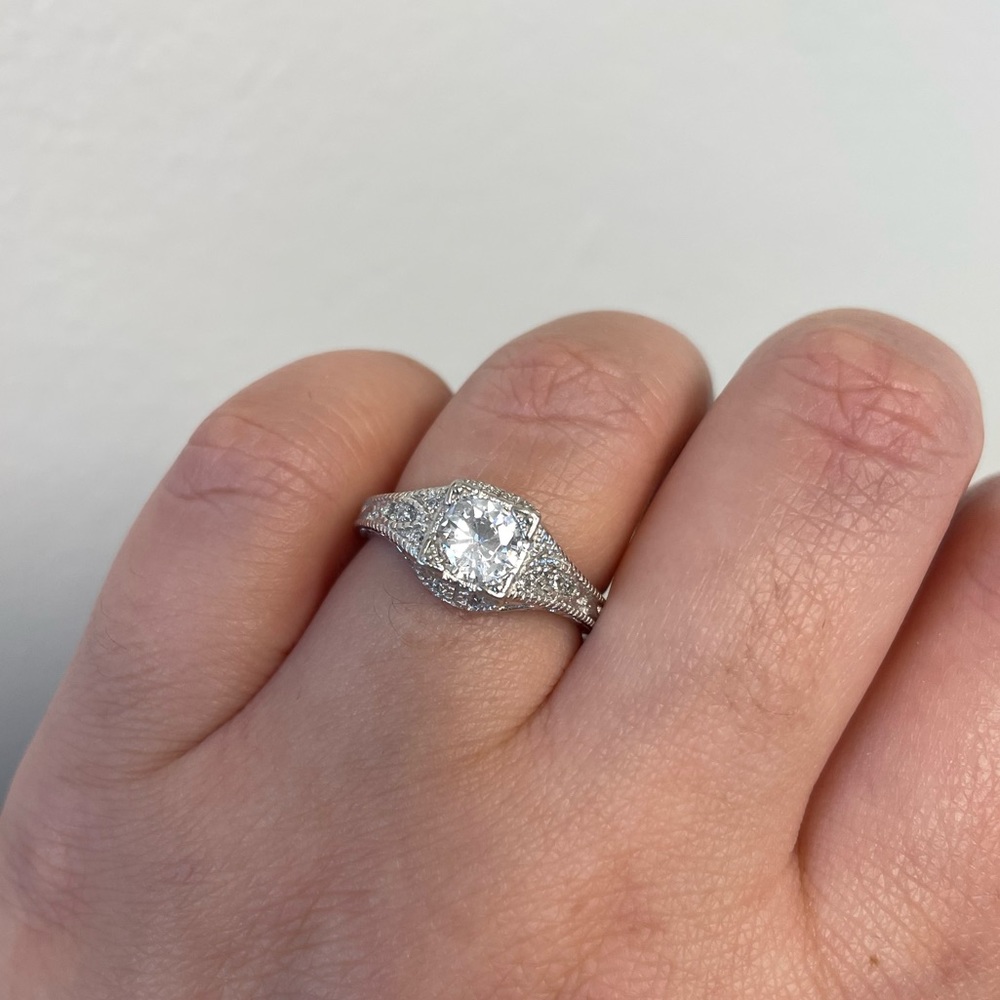 Vintage-Inspired Silver Halo Engagement Ring with Clear Center Stone